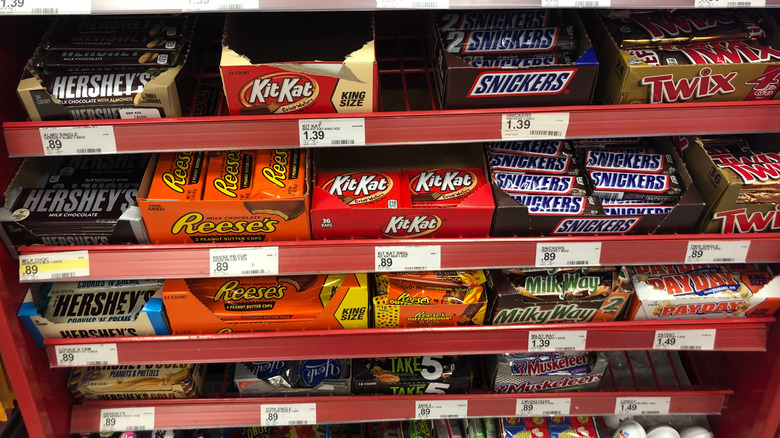Variety of candy bars on a store shelf