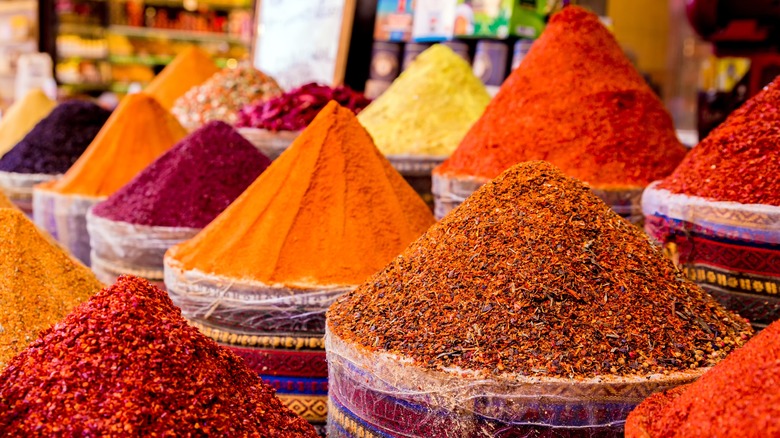 Assorted colorful spices in baskets