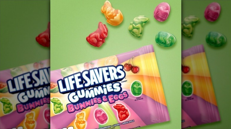 Lifesaver bunnies and eggs gummies on green background