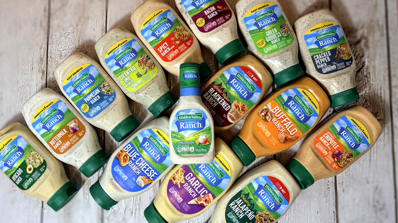 Top down view of various bottles of ranch dressing arranged on a table