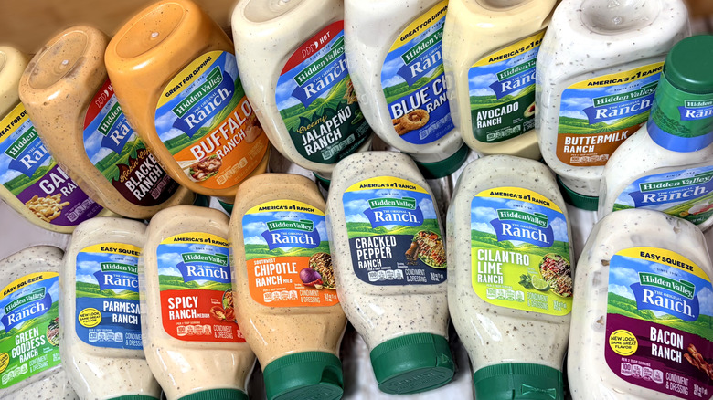 Various bottles of ranch dressing arranged on table