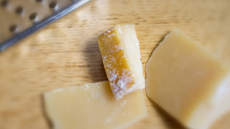 parmesan rinds on wooden background