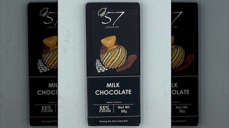 A bar of '57 Chocolate Milk Chocolate is set on a grey background.