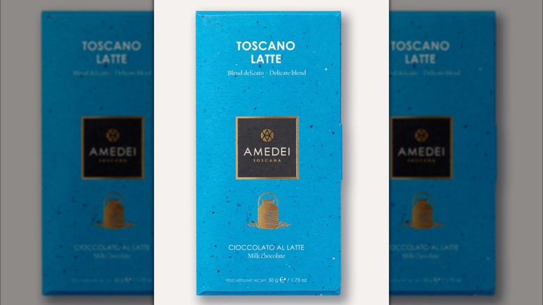 A bar of Amedei Toscano Latte is on a white background.