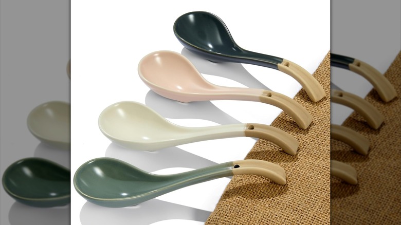 Four DAHO GOMSU ceramic soup spoons lined up