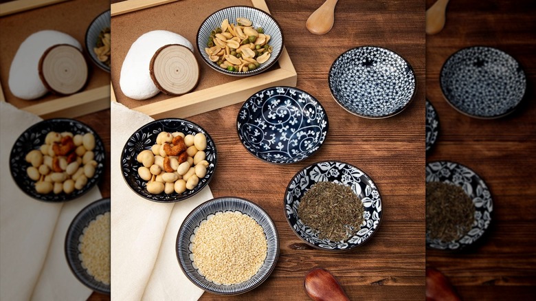 Eisinly tiny appetizer and condiment plates on a wood floor