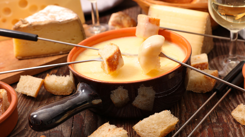 Cheese fondue pot with bread