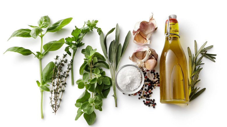 fresh herbs and olive oil bottle