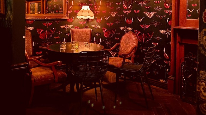 victorian parlor with butterfly wallpaper