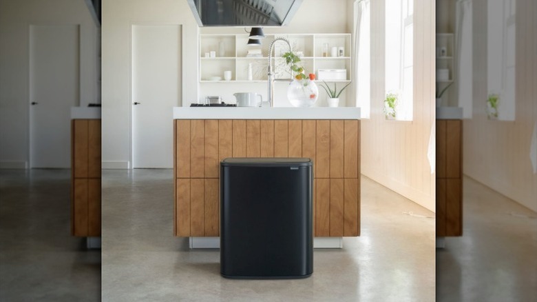 Brabantia trash can next to counter in kitchen