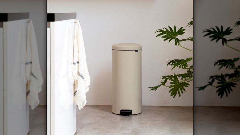 Brabantia New Icon trash can sits by wall