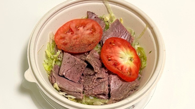A Wawa roast beef no-bun hoagie against a white background