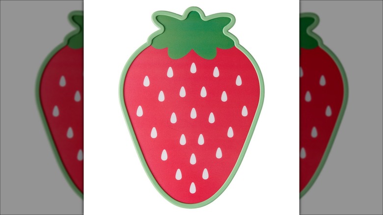 Product image of the strawbery Crofton fruit-shaped cutting board against a white background.