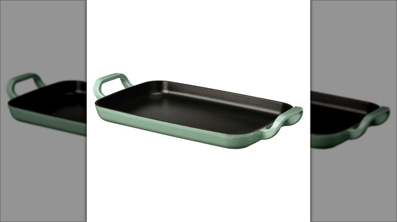 Product image of the Crofton two-burner griddle with a black cooktop and sage green bottom against a white background.