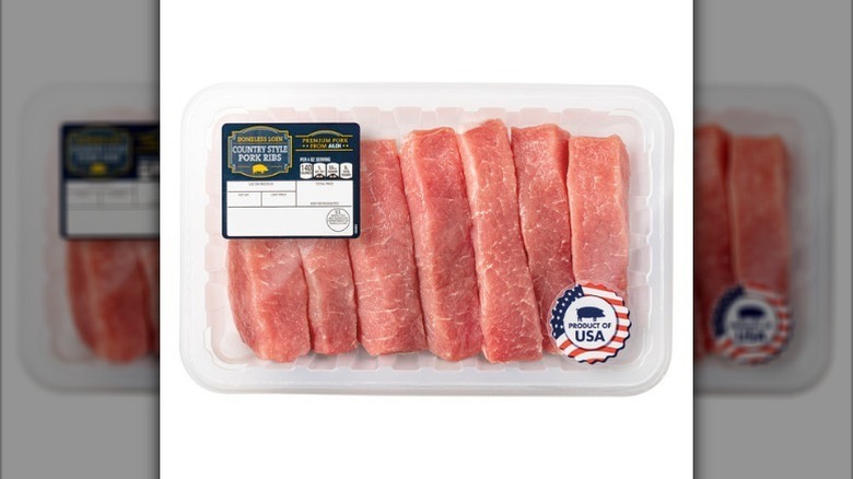 Boneless pork country style ribs on white background