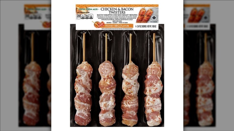 Bacon wrapped chicken skewers on white background