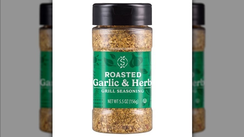 Roasted garlic and herb seasoning on white background