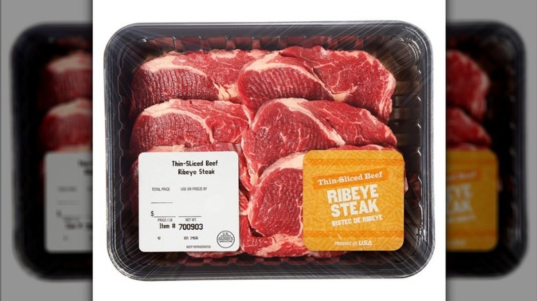 Thin sliced ribeye on white background