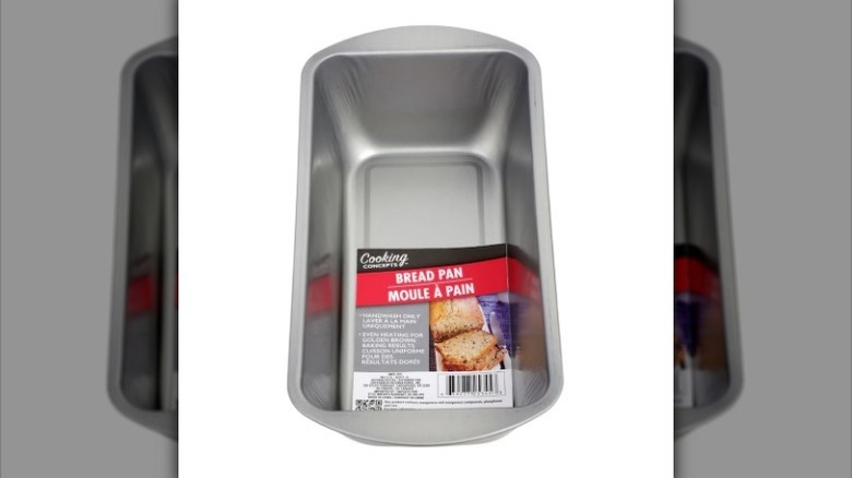 Metal loaf pan on white background