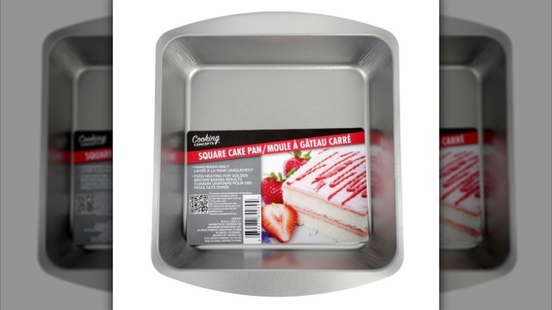 Square metal cake pan on white background