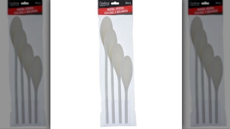 White plastic mixing spoon package on white background