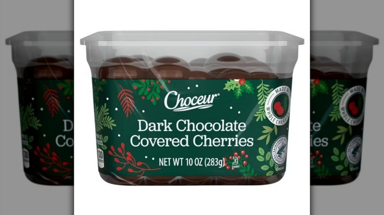 Dark chocolate cherries on white background