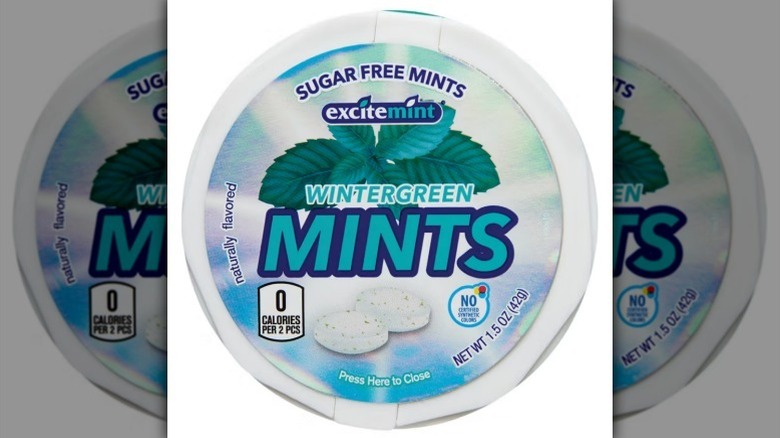 Container of Excitemint wintergreen mints on white background