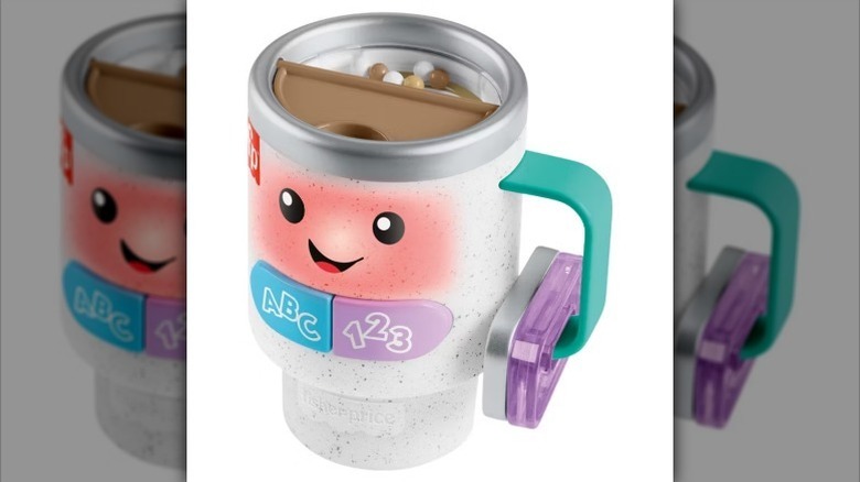 Kids coffee cup toy on white background