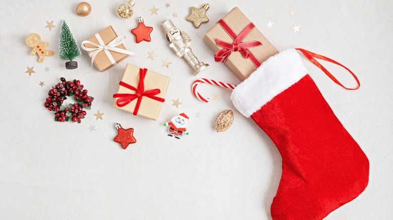 Red Christmas stocking with gifts coming out