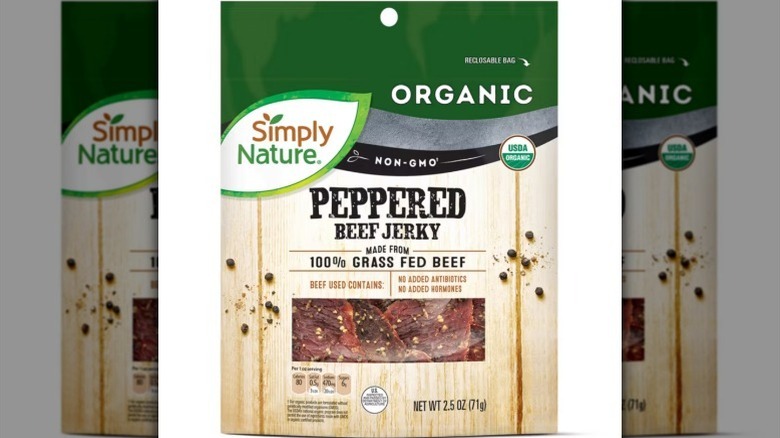 A bag of Simply Nature peppered beef jerky on white background