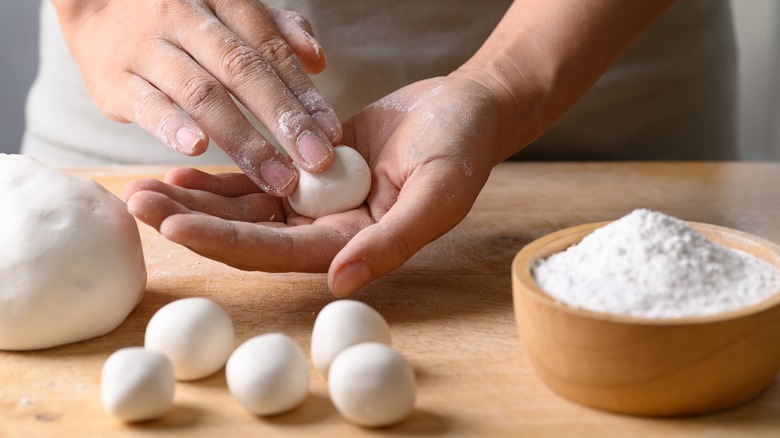 person making dessert with rice flour