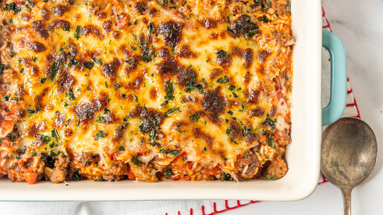A cheeseburger casserole with crispy cheese on top