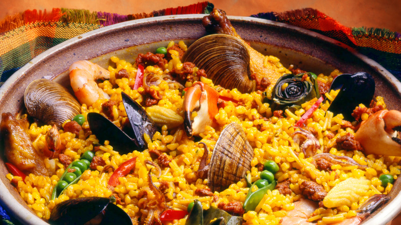 A closeup shot of a colorful bowl of seafood paella
