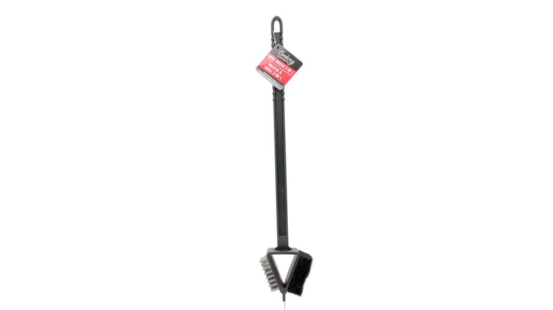 A black plastic grill brush with bristles, a scraper, and a sponge