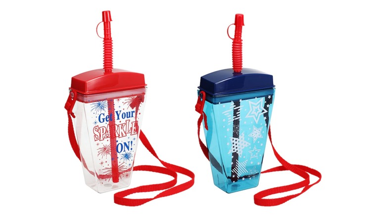 Two wearable plastic cups, one clear with a red lid and straw, and one blue with a blue lid and red straw
