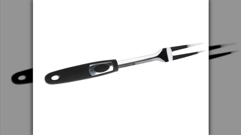 Two prong fork with black handle on white background