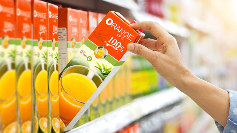 orange juice on supermarket shelf