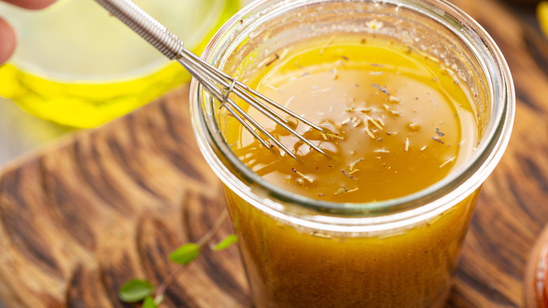 whisk in Italian dressing jar