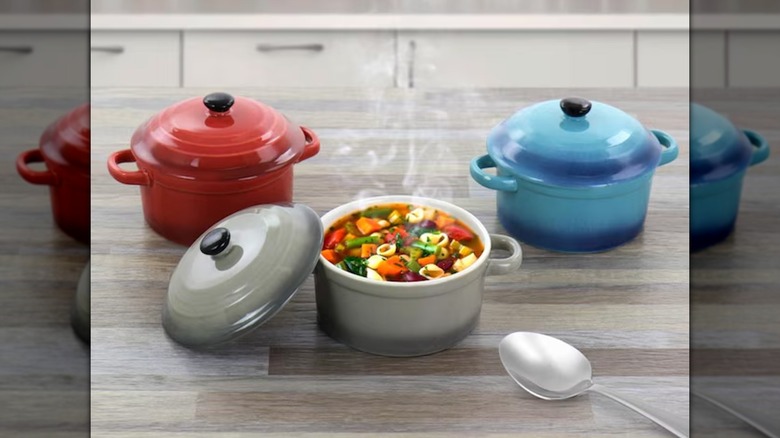 Crock-Pot Ceramic Soup Pot Set on a countertop, with the gray pot open with hot soup inside