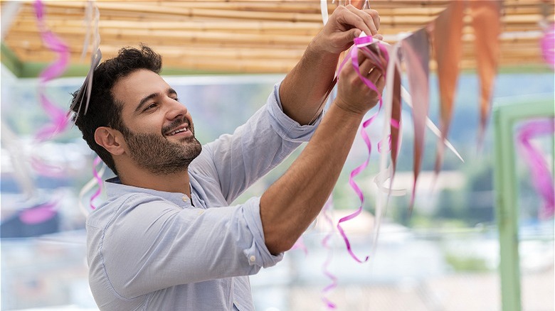 man setting up a party