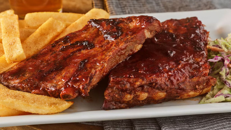 Plate of Red Robin's Whiskey River BBQ ribs and fries