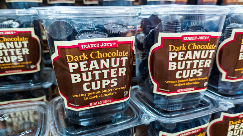 Tubs of Trader Joe's Dark Chocolate Peanut Butter Cups stacked