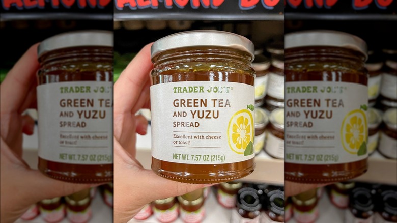 A hand holding a jar of Trader Joe's Green Tea & Yuzu Spread