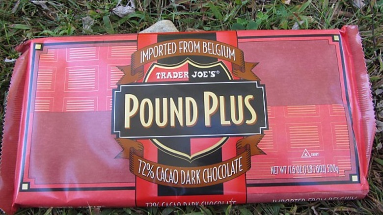 Trader Joe's Pound Plus 72% Cacao Dark Chocolate Bar on green grass
