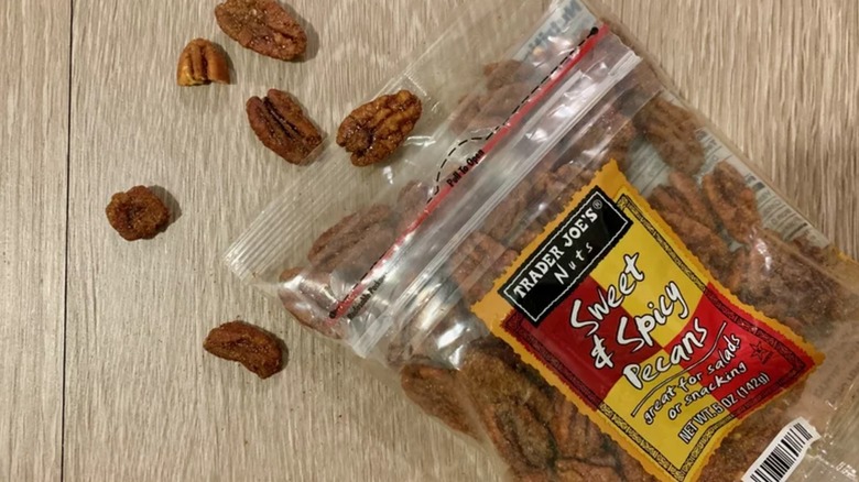 Package of Trader Joe's Sweet & Spicy Pecans on a wooden background