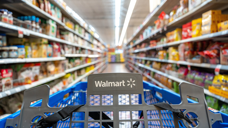 Close up of Walmart cart with blurred aisles
