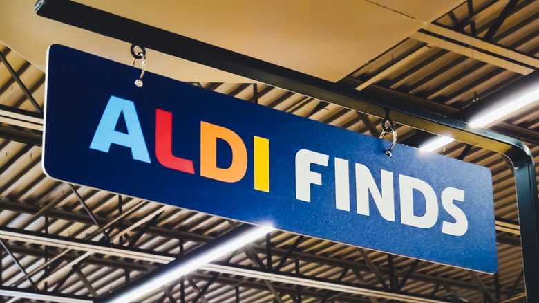 Close-up of an Aldi Finds sign hanging in store.