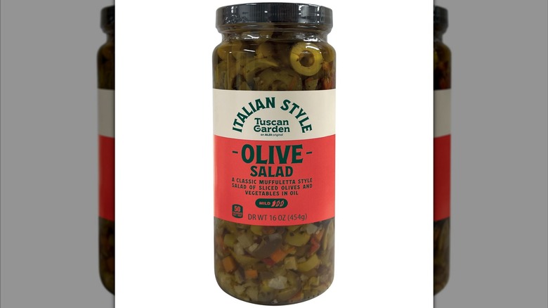 Jar of Tuscan Garden Muffuletta Olive Salad from Aldi against white background.