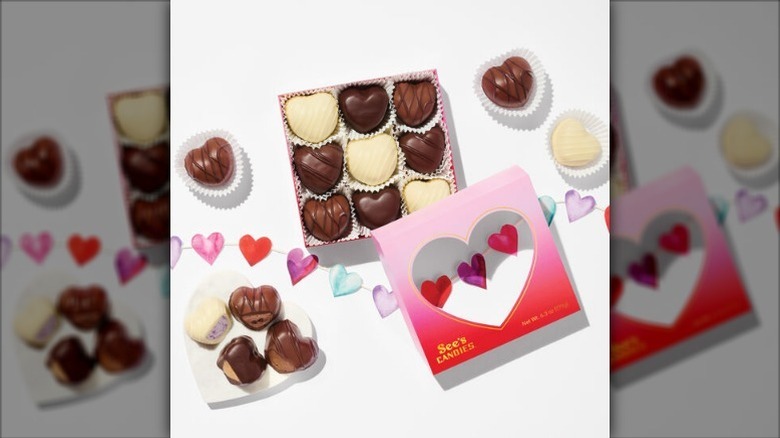 Open Sweetest Hearts box on white surface with heart string