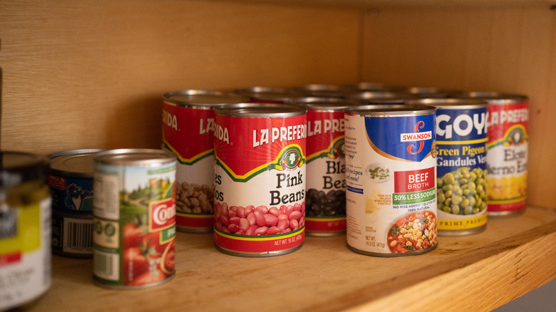 canned foods on cabinet shelf